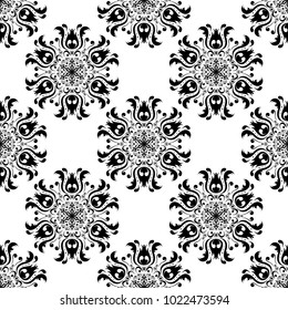 Black floral ornament on white background. Seamless pattern for textile and wallpapers