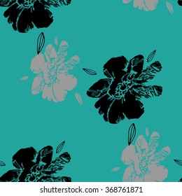Black flowers on a turquoise background.
