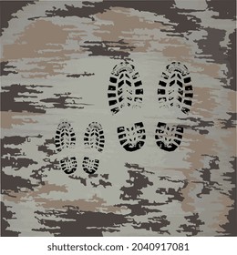 Black footprints of shoes. Small footprints next to large ones. Father with a child. Dirty shoe prints. Dad and son walk.