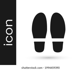 Black Footsteps icon isolated on white background. Detective is investigating. To follow in the footsteps.  Vector
