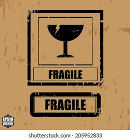 Black fragile symbol on cardboard the word "Fragile" - Vector.