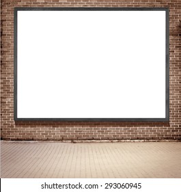 Black frame billboard with copy space hanging on brown brick wall near the street