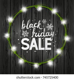 Black friday background with light bulbs frame