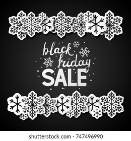 Black friday background with paper snowflakes 