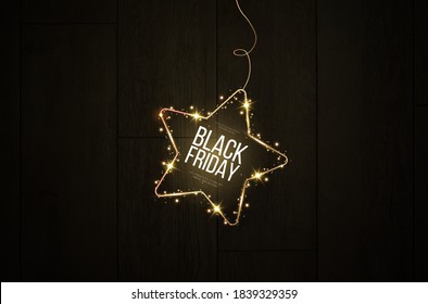 Black friday banner mockup.  A festive golden, glowing frame that is strewn with gold dust. Star light PNG.