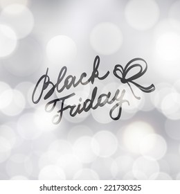 black friday, handwritten text on blurred background with lights