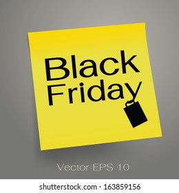Black Friday message on yellow sticker notepaper on dark background. 