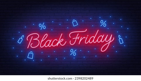 Black Friday neon lettering on brick wall background.