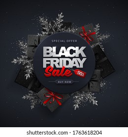 Black friday sale banner with gift boxes and snowflakes on dark black background