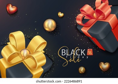 Black Friday Sale. Decorative gift box with golden bow and red bow isolated on dark for event sale design.