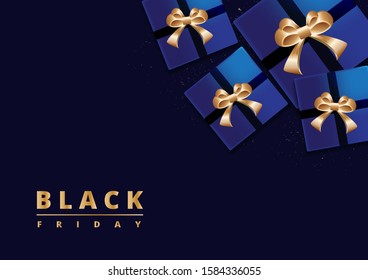 Black Friday sale. Gift box decorated with gold bow on dark blue background. Top view.