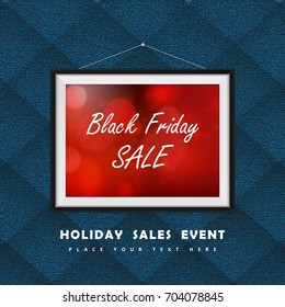 Black Friday Sale label in photo frame hanged on the textile clothes wall