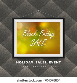Black Friday Sale label in photo frame hanged on the textile clothes wall