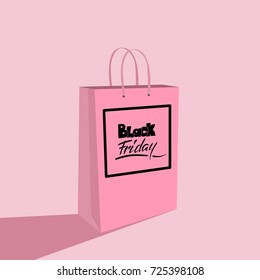 Black Friday sale lettering on a shopping paper bag. Hand drawn text to mega sale.