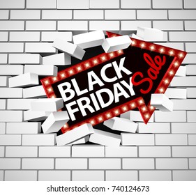 A Black Friday sale sign breaking through a white brick wall