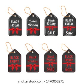 black friday sale white and red letterings with yellow thread and red ribbon and bow on trendy black tags. black friday commercial illustartion for seasonal promotions and advertising in stores