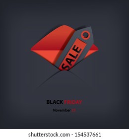 Black Friday sales invitation card in an envelope blending into dark background