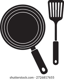 Sartén negra y espátula utensilios de cocina