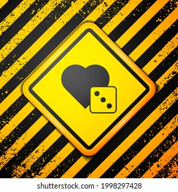 Black Game dice icon isolated on yellow background. Casino gambling. Warning sign. Vector