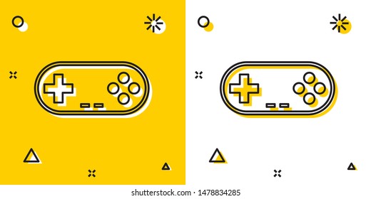 Black Gamepad icon isolated on yellow and white background. Game controller. Random dynamic shapes. Vector Illustration