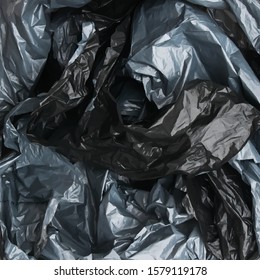 Black garbage bag texture for design- concept of saving the environment and plastic pollution of the world ocean
