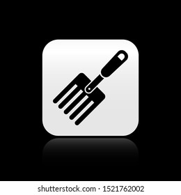 Black Garden fork icon isolated on black background. Pitchfork icon. Tool for horticulture, agriculture, farming. Silver square button. Vector Illustration