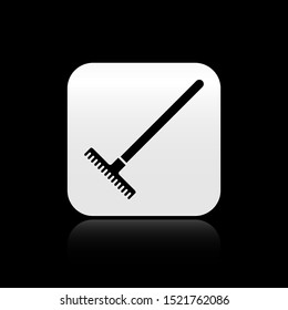 Black Garden rake icon isolated on black background. Tool for horticulture, agriculture, farming. Ground cultivator. Housekeeping equipment. Silver square button. Vector Illustration