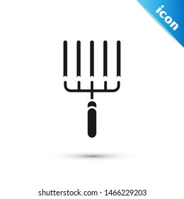 Black Garden rake in work icon isolated on white background. Tool for horticulture, agriculture, farming. Ground cultivator.  Vector Illustration