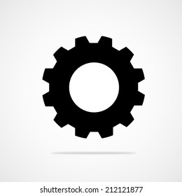 Black gear or cog vector icon with shadow on a white background.