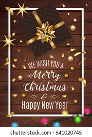 Black gift box with a beautiful gold bow on wooden background. Merry Christmas and Happy New Year greeting card. Vintage Background With Typography and Decoration Elements card Vector, eps 10