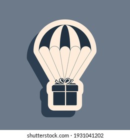 Black Gift box flying on parachute icon isolated on grey background. Delivery service, air shipping concept, bonus concept. Long shadow style. Vector Illustration