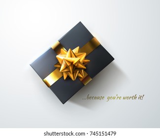 Black gift box with glittering golden bow and crossing ribbons isolated on white background. Vector realistic festive illustration. Decoration element for design.