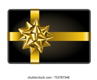 Black gift box with golden bow, top view
