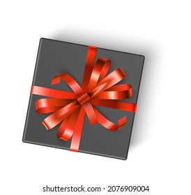 Black gift box with red bow. Top view realistic present