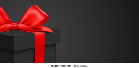 Black gift box with red ribbon, close up on the black background. Premium style card vector design, with present box, and copy space. Gift card, for Christmas, New Year, or any holiday product offer.