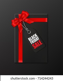 Black gift box with red ribbon and bow and tag with Black Friday Sale text on black background. Vector illustration.