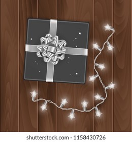 Black gift box, top view, gift box isolated on transparent background with silver bow