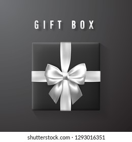 Black gift box with white, silver bow and ribbon top view. Element for decoration gifts, greetings, holidays. Vector illustration.