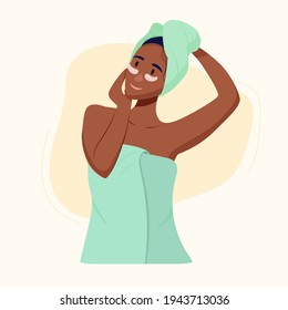 black girl cares for the skin. The girl in a towel on her head makes a facial massage.