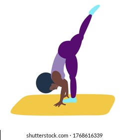 The black girl is engaged in fitness or yoga. An athletic African-American woman does yoga.Healthy lifestyle, care for the health of the body