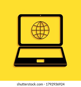 Black Globe on screen of laptop icon isolated on yellow background. Notebook computer with globe sign. Long shadow style. Vector