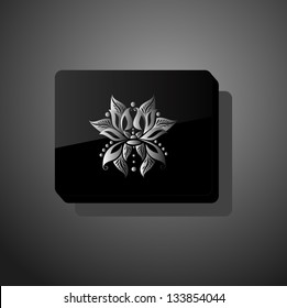 Black glossy form with abstract flower