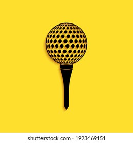 Black Golf ball on tee icon isolated on yellow background. Long shadow style. Vector
