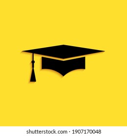 Black Graduation cap icon isolated on yellow background. Graduation hat with tassel icon. Long shadow style. Vector.