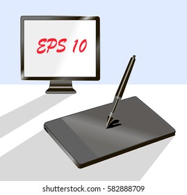 Black graphic tablet with stylus pen and  matrix monitor.