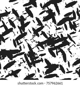 Black and gray paint splashes on a white background for wallpaper and design.
