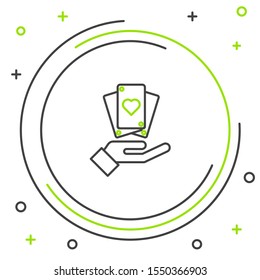 Black and green line Hand holding playing cards icon isolated on white background. Casino game design. Colorful outline concept. Vector Illustration