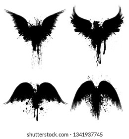 Black grunge bird wings silhouettes with ink splash isolated on white background