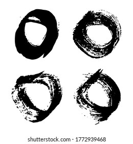 Black grunge brush strokes. Set of four painted rounded shapes. Ink circle spot isolated on white background. Vector illustration