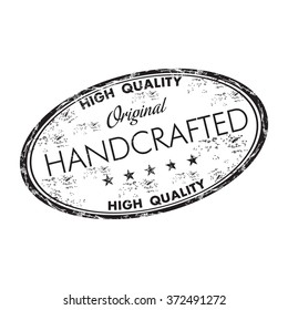 Black grunge rubber oval stamp with the word handcrafted written inside the stamp